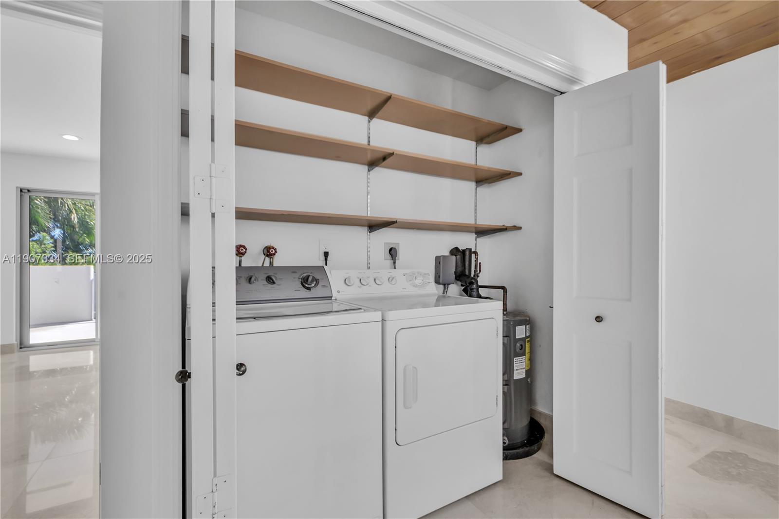 2089 Northeast 121st Road North Miami, FL 33181 - Photo 22 of 30 a room with storage and utility