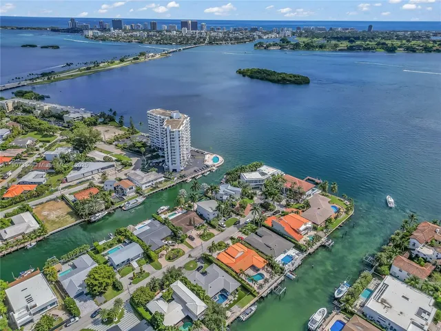 an aerial view of a house with a lake view