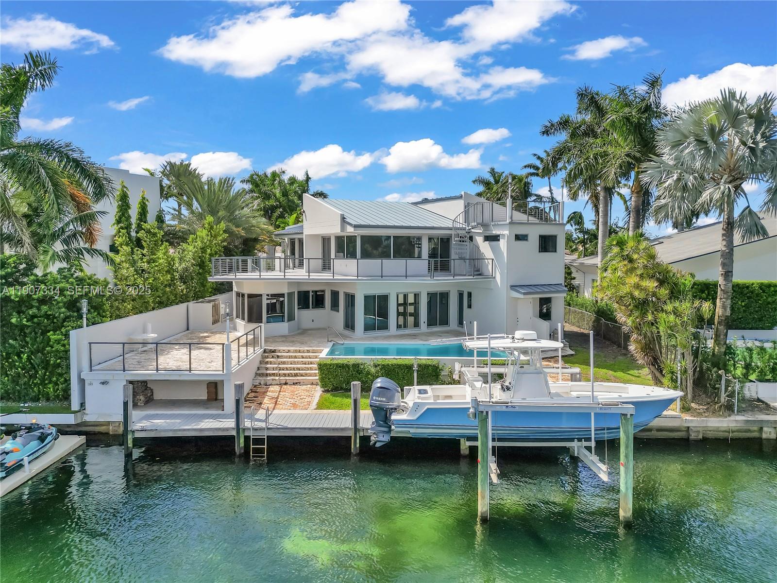 2089 Northeast 121st Road North Miami, FL 33181 - Photo 10 of 30 a view of a house with a yard deck and sitting area