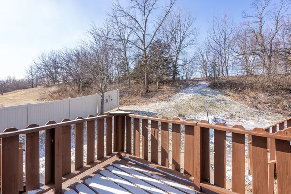 a view of wooden fence and trees