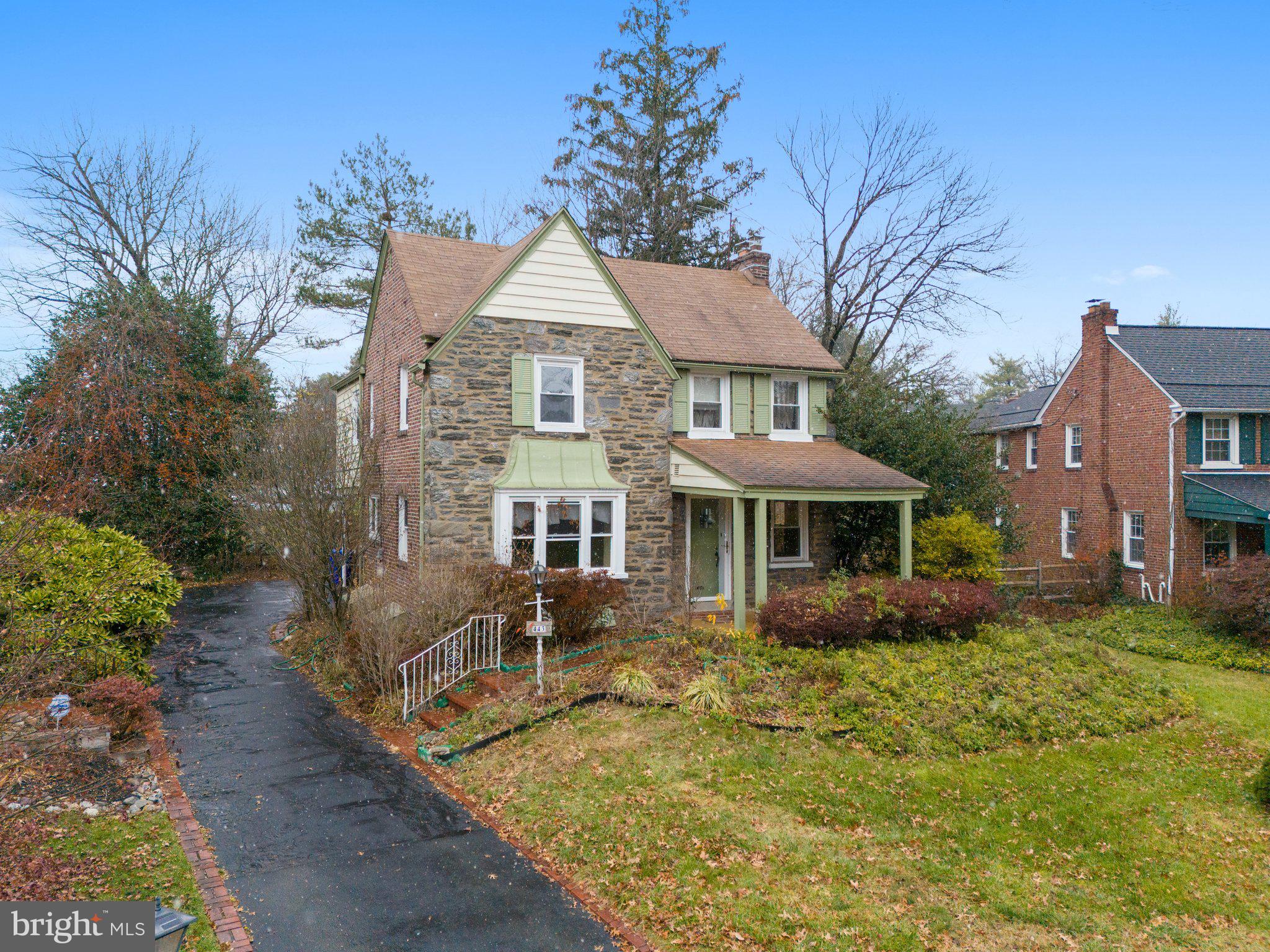 443 Old Farm Road Wyncote, PA 19095 - Photo 1 of 35 a front view of a house with garden