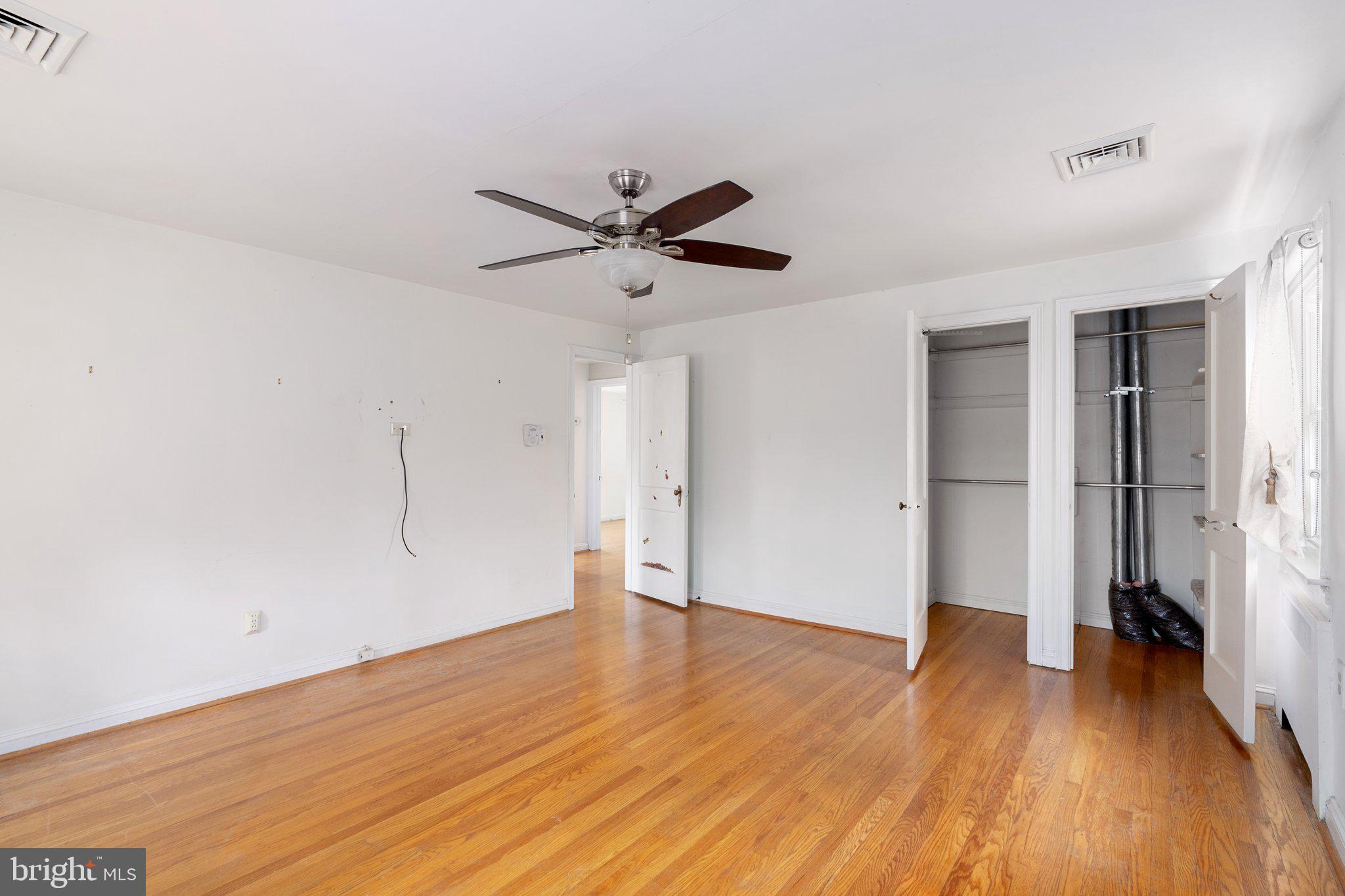 443 Old Farm Road Wyncote, PA 19095 - Photo 21 of 35 an empty room with wooden floor and a ceiling fan