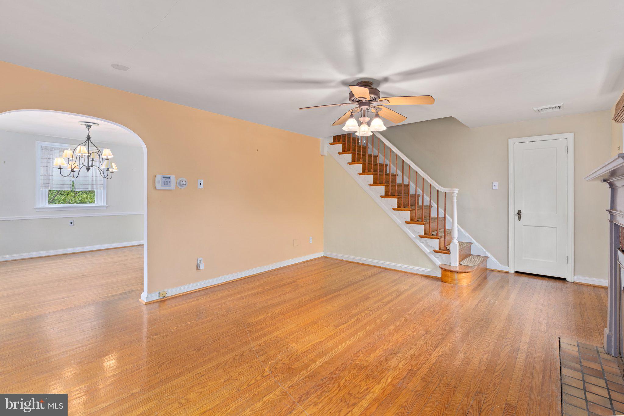 443 Old Farm Road Wyncote, PA 19095 - Photo 8 of 35 a view of an empty room with wooden floor and a chandelier