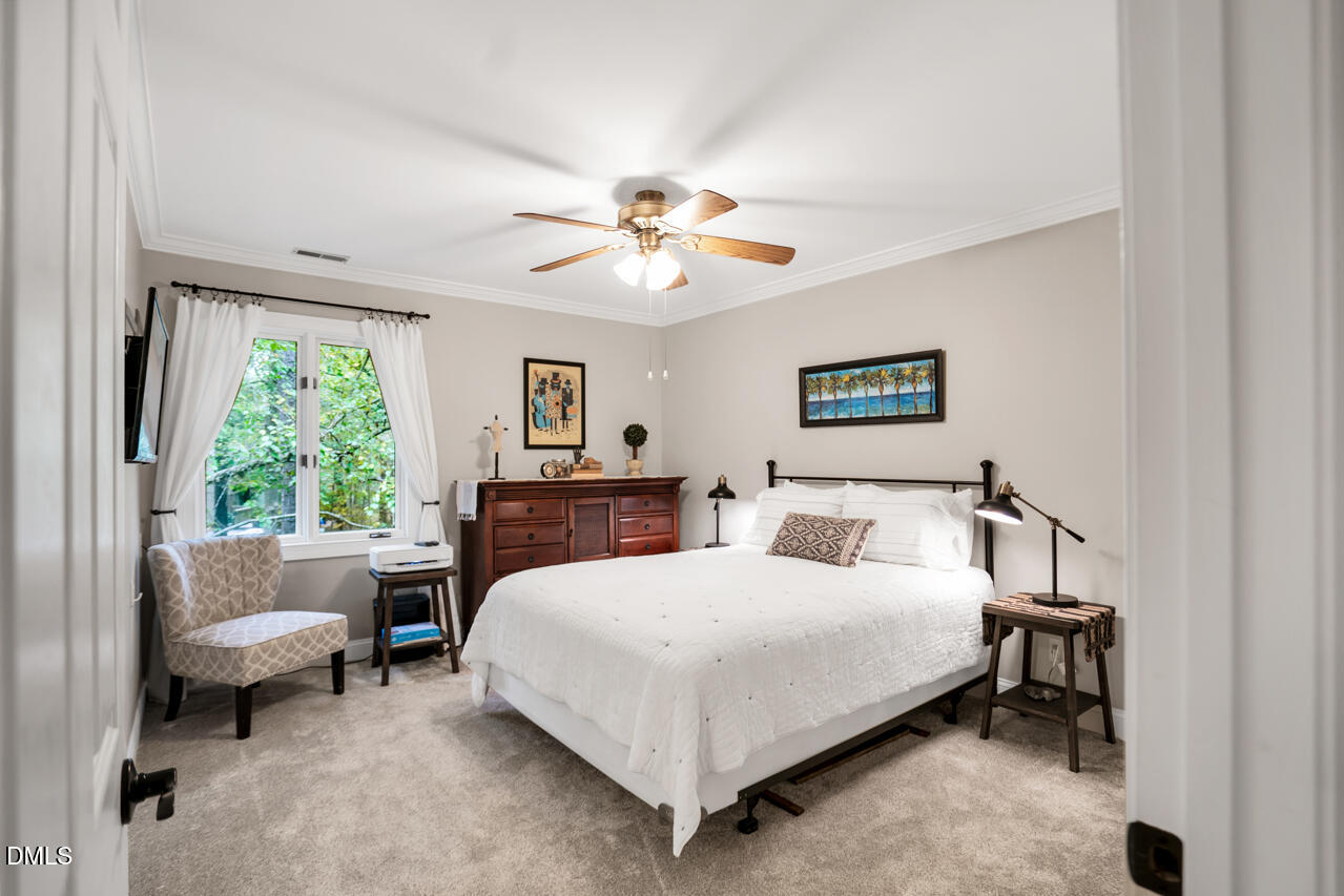 83 Stoneridge Road Durham, NC 27705 - Photo 37 of 51 a bedroom with a bed and a couch