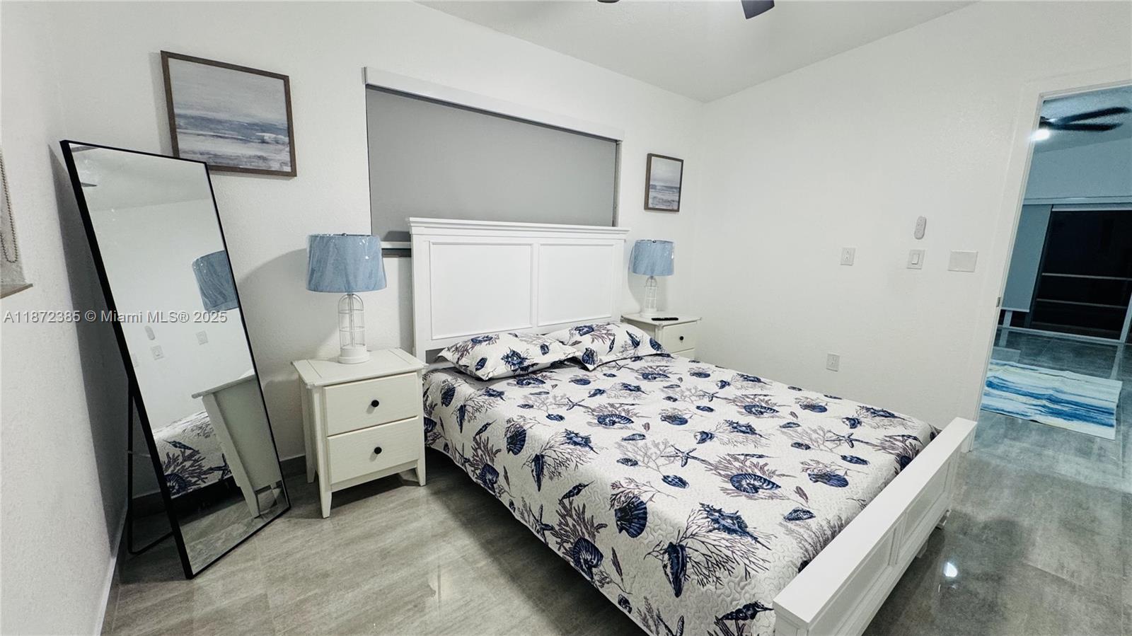 60 Southeast Marlin Avenue, Unit 2 Key Largo, FL 33037 - Photo 12 of 26 a bedroom with a bed and a tv in it
