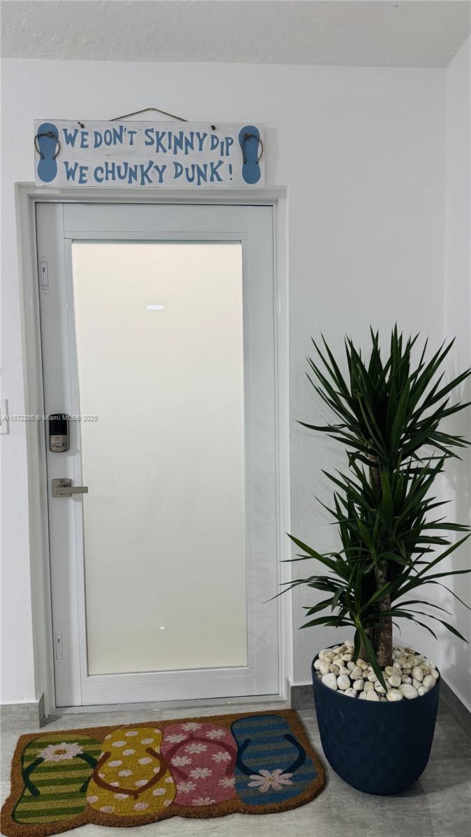 60 Southeast Marlin Avenue, Unit 2 Key Largo, FL 33037 - Photo 18 of 26 a vase of flowers sitting on a table