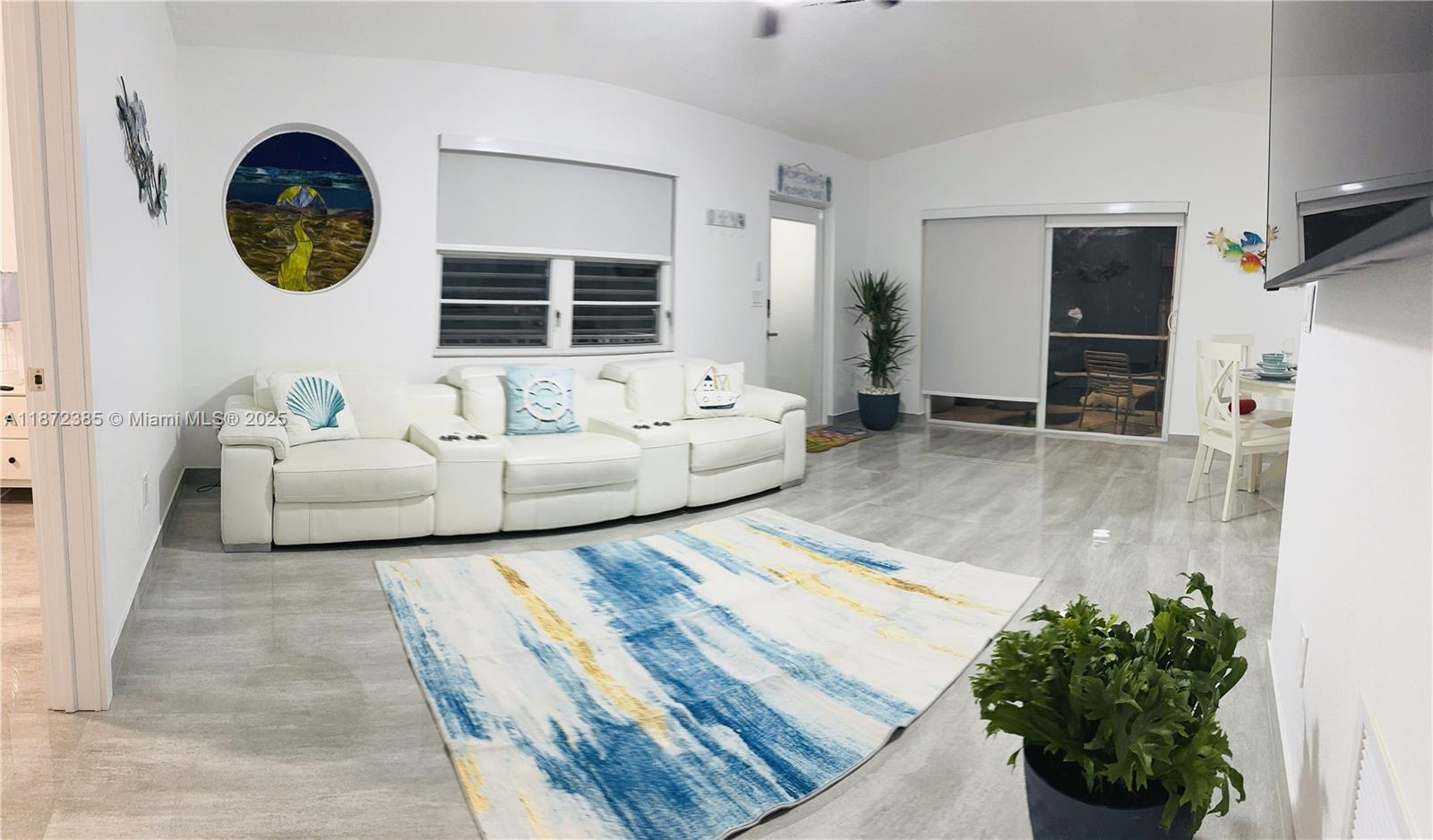 60 Southeast Marlin Avenue, Unit 2 Key Largo, FL 33037 - Photo 4 of 26 a living room with furniture and a large window