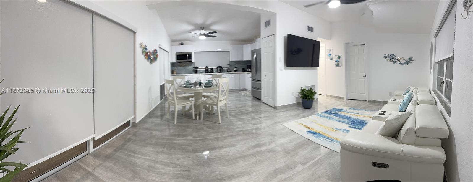 60 Southeast Marlin Avenue, Unit 2 Key Largo, FL 33037 - Photo 5 of 26 a living room with furniture and a flat screen tv