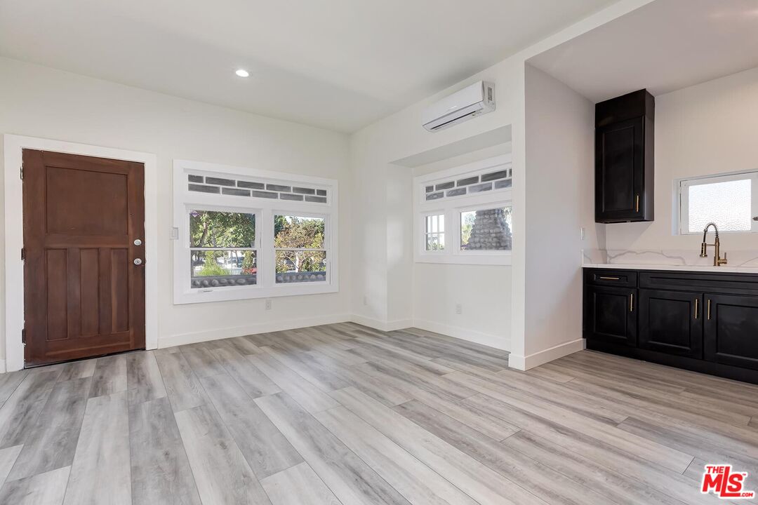 1054 Maine Avenue, Unit 2 Long Beach, CA 90813 - Photo 8 of 21 wooden floor in an empty room with a window