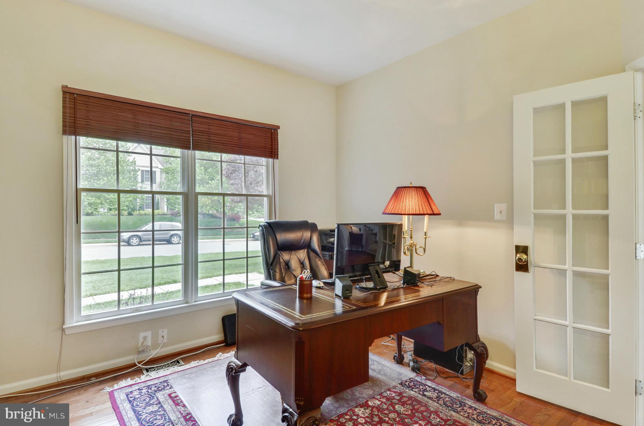 1327 Dasher Lane Reston, VA 20190 - Photo 16 of 30 a view of a workspace with furniture and a window