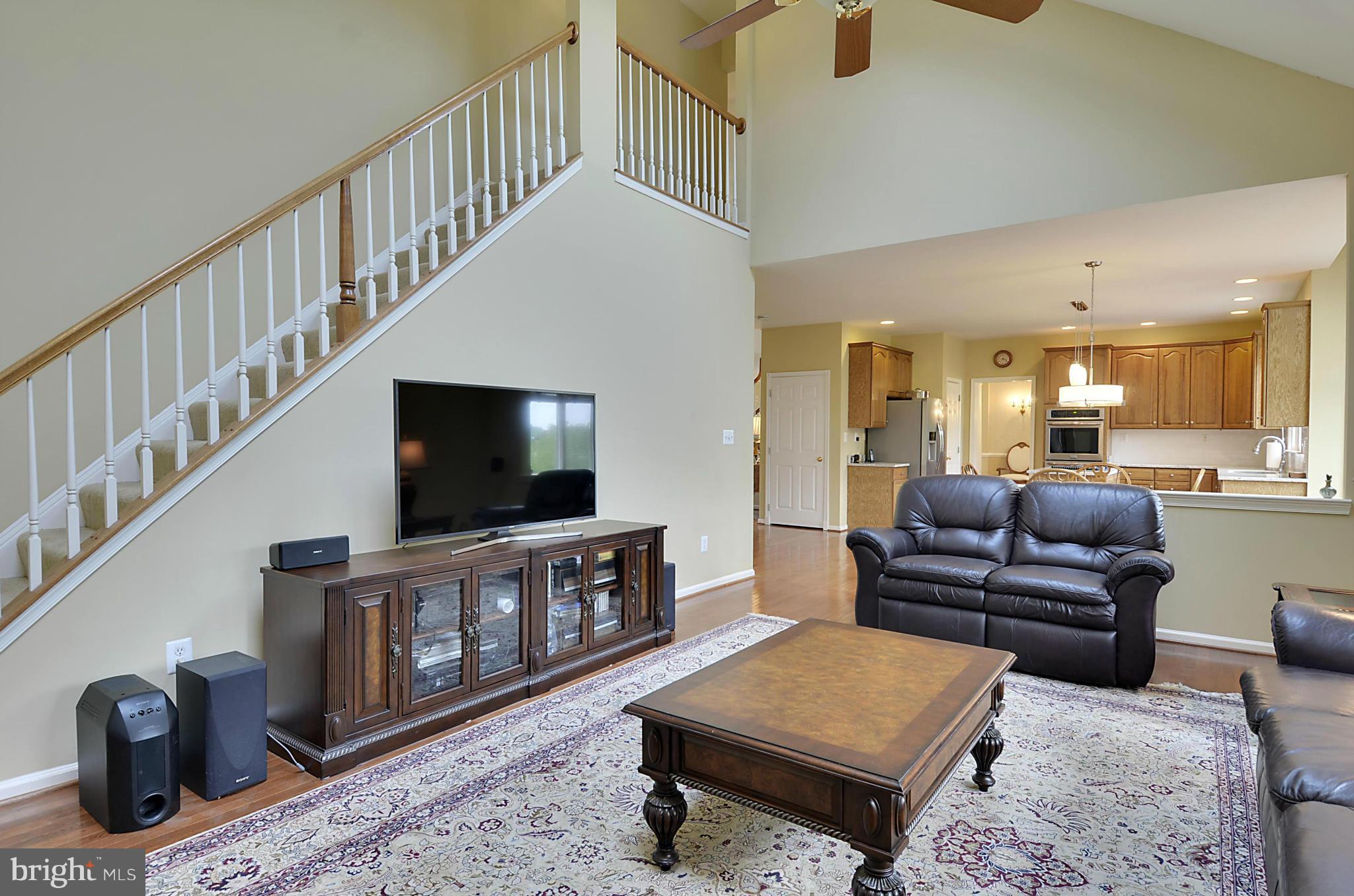 1327 Dasher Lane Reston, VA 20190 - Photo 8 of 30 a living room with furniture and a flat screen tv