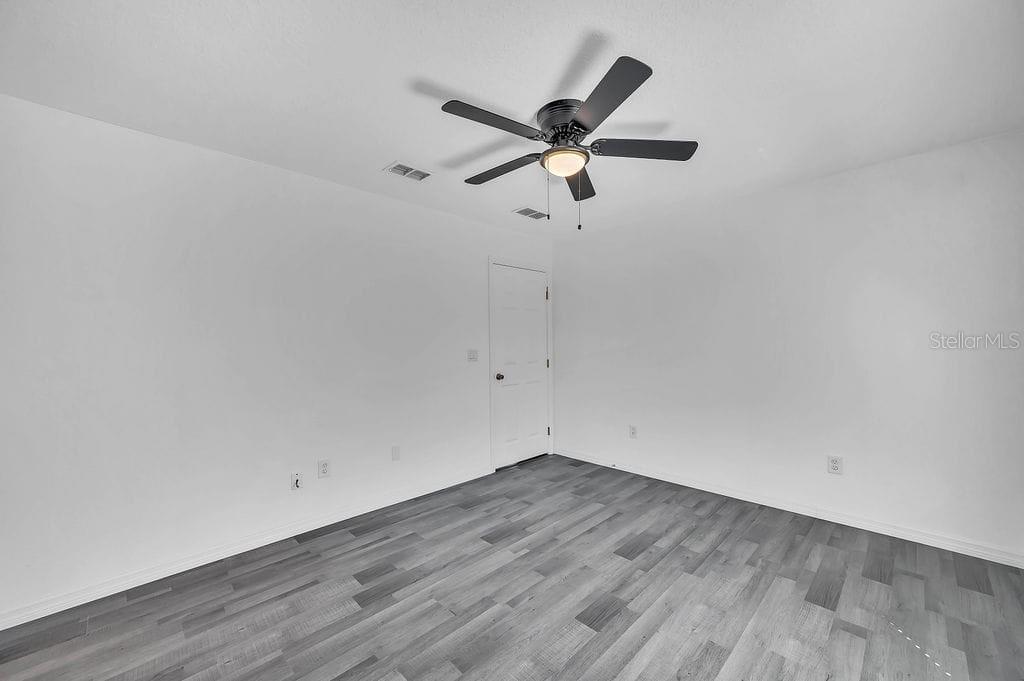 8695 Southwest 60th Circle Ocala, FL 34476 - Photo 11 of 19 wooden floor in an empty room