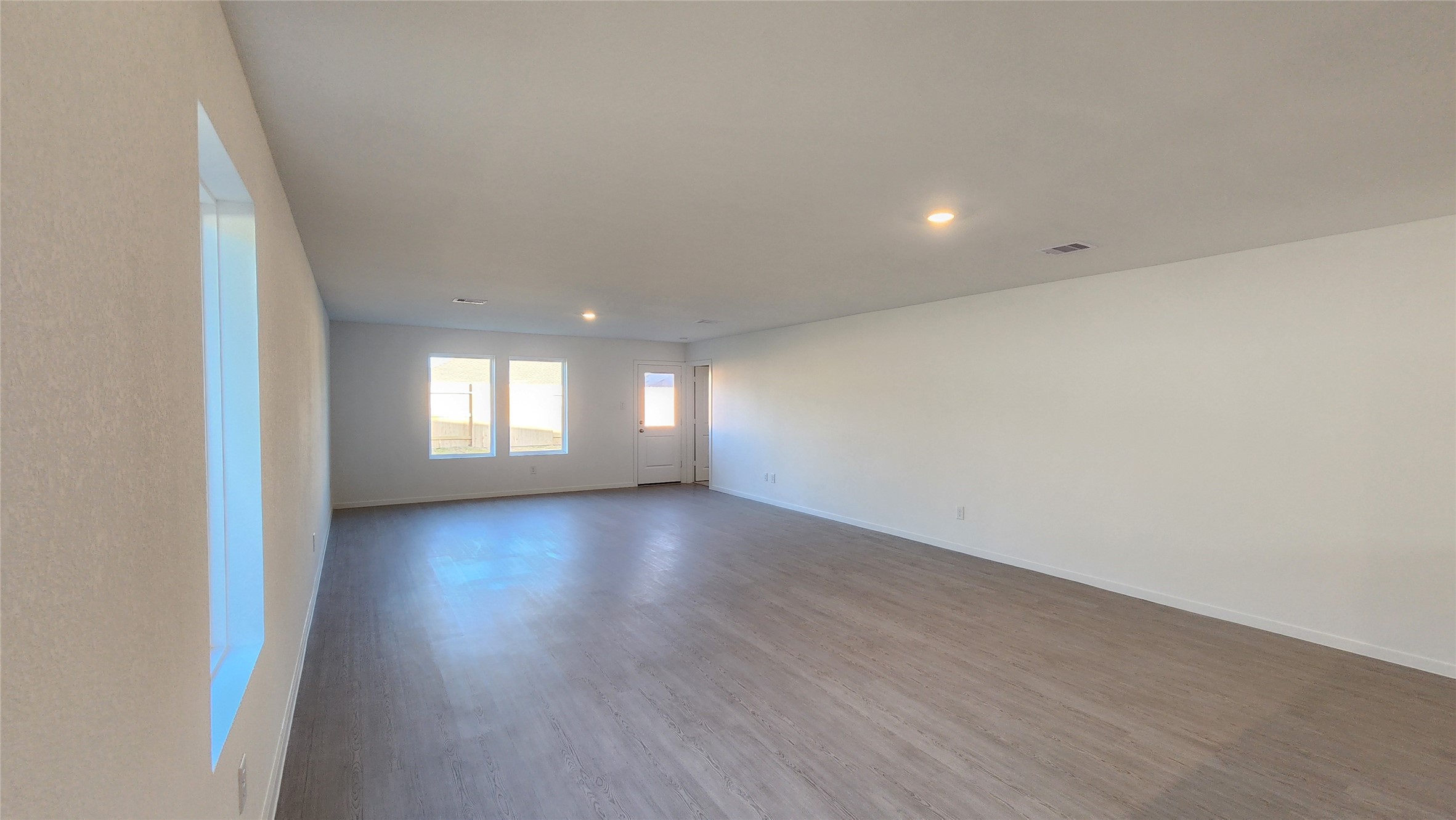 16210 Rustic Prairie Drive Hockley, TX 77447 - Photo 11 of 40 a view of empty room with wooden floor and fan