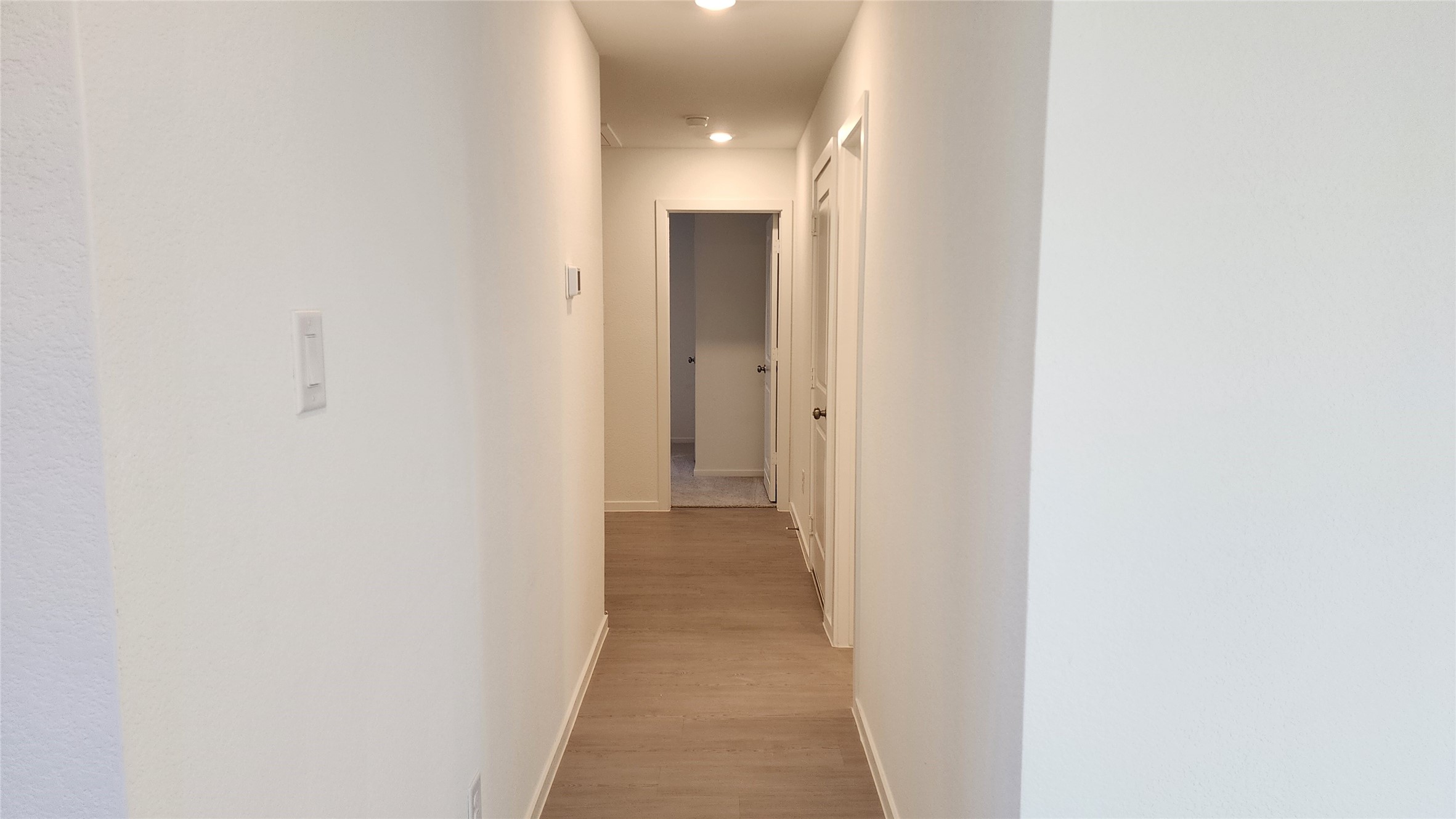 16210 Rustic Prairie Drive Hockley, TX 77447 - Photo 24 of 40 a view of a hallway with wooden floor