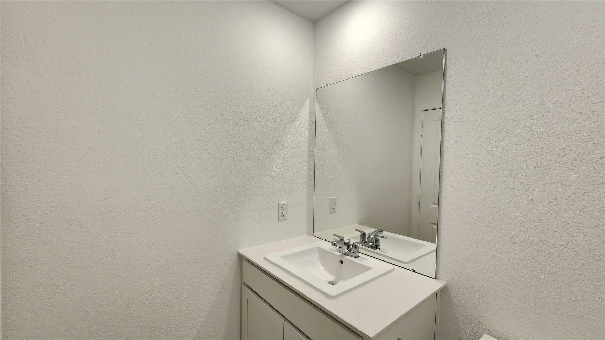 16210 Rustic Prairie Drive Hockley, TX 77447 - Photo 27 of 40 a bathroom with a sink and a mirror