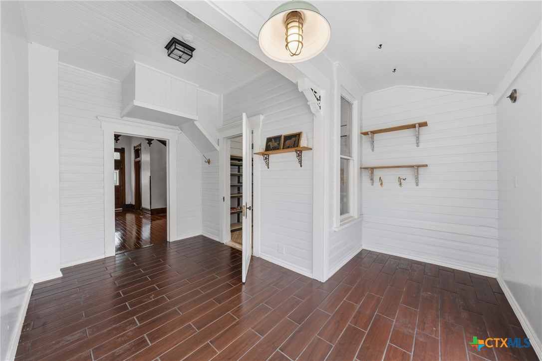 300 Estelle Rice Street Moody, TX 76557 - Photo 11 of 48 an empty room with wooden floor and hallway