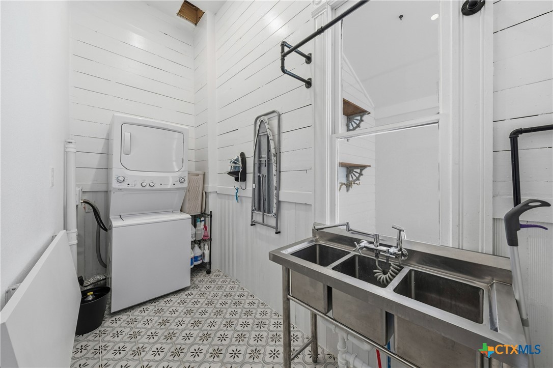 300 Estelle Rice Street Moody, TX 76557 - Photo 12 of 48 a room with a stove a washer and dryer