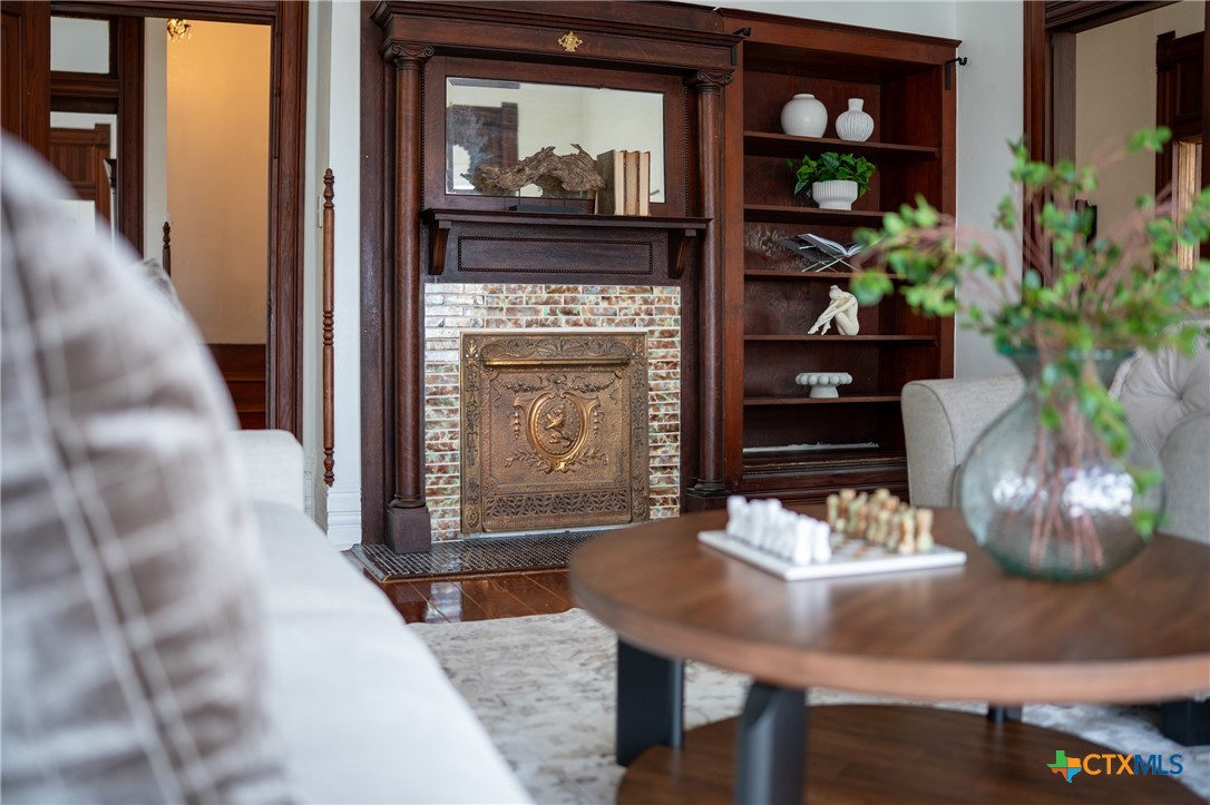 300 Estelle Rice Street Moody, TX 76557 - Photo 13 of 48 a dining room with fireplace and wooden floor