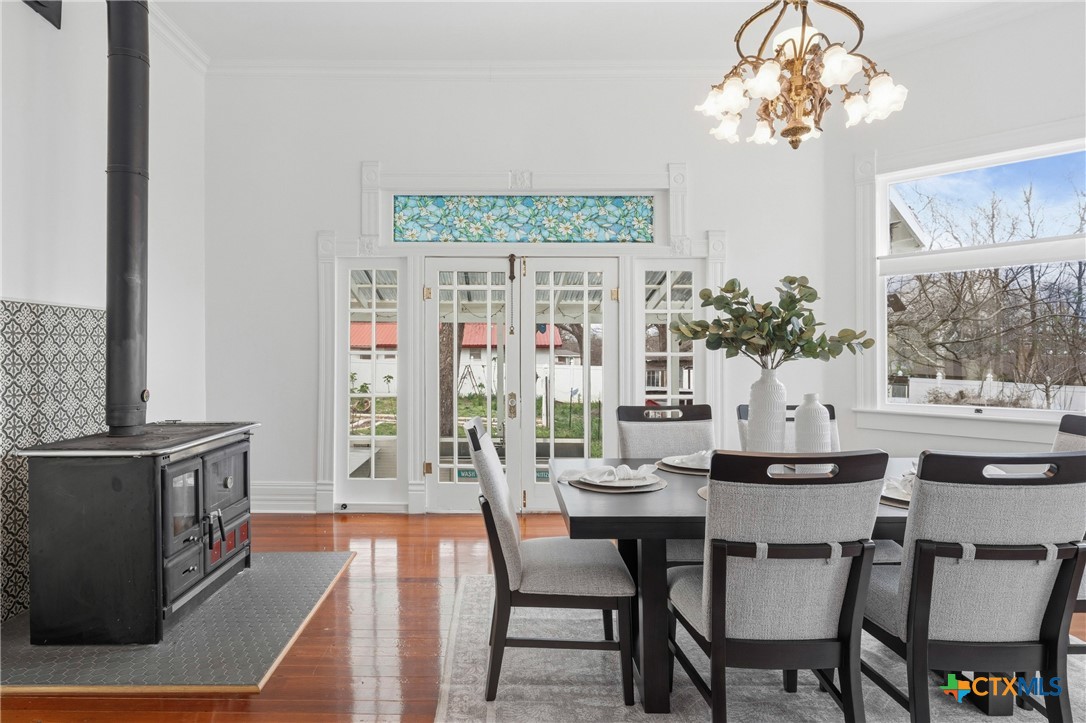 300 Estelle Rice Street Moody, TX 76557 - Photo 16 of 48 a dining room with furniture a rug and a chandelier
