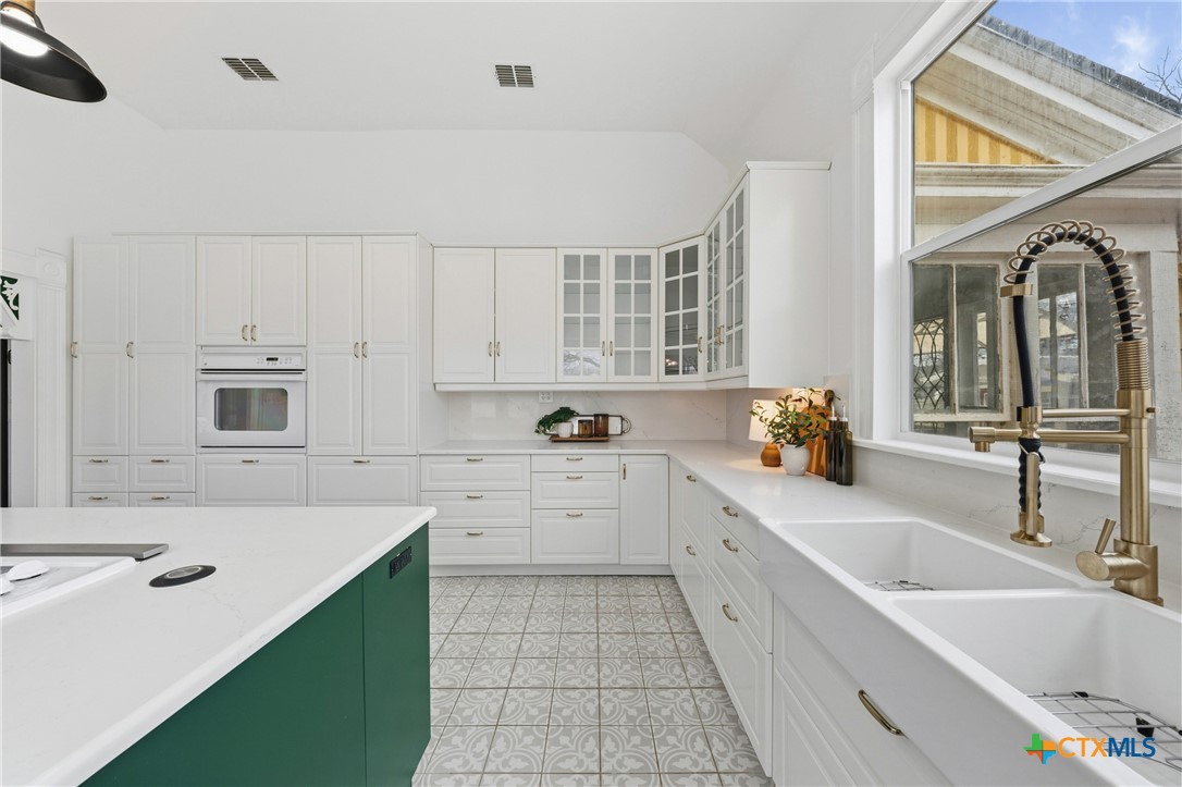 300 Estelle Rice Street Moody, TX 76557 - Photo 20 of 48 a large white kitchen with a sink and cabinets