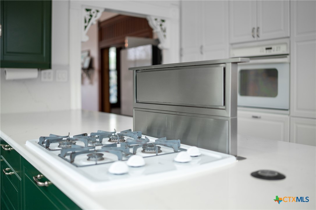 300 Estelle Rice Street Moody, TX 76557 - Photo 23 of 48 a kitchen with a sink a stove and cabinets