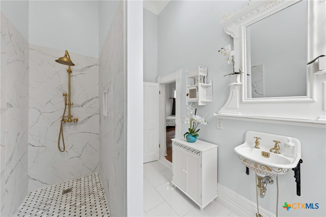 300 Estelle Rice Street Moody, TX 76557 - Photo 28 of 48 a bathroom with a sink a toilet and shower