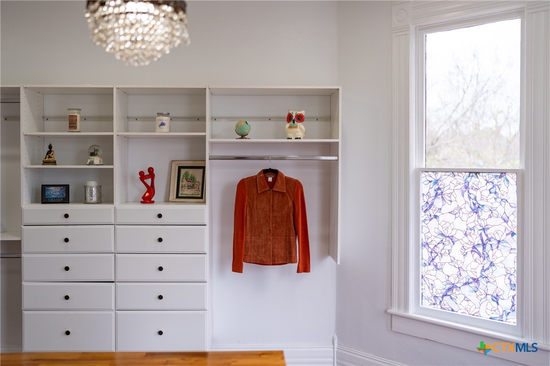 300 Estelle Rice Street Moody, TX 76557 - Photo 37 of 48 a view of walk in closet with clothes and shoes