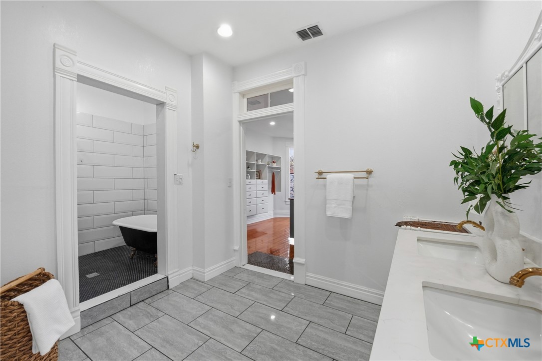 300 Estelle Rice Street Moody, TX 76557 - Photo 39 of 48 a hallway with a storage and utility room