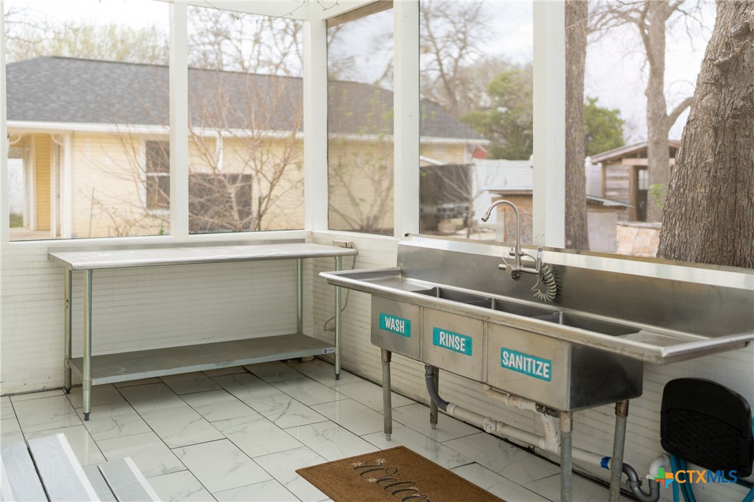 300 Estelle Rice Street Moody, TX 76557 - Photo 44 of 48 a kitchen with a sink and a stove