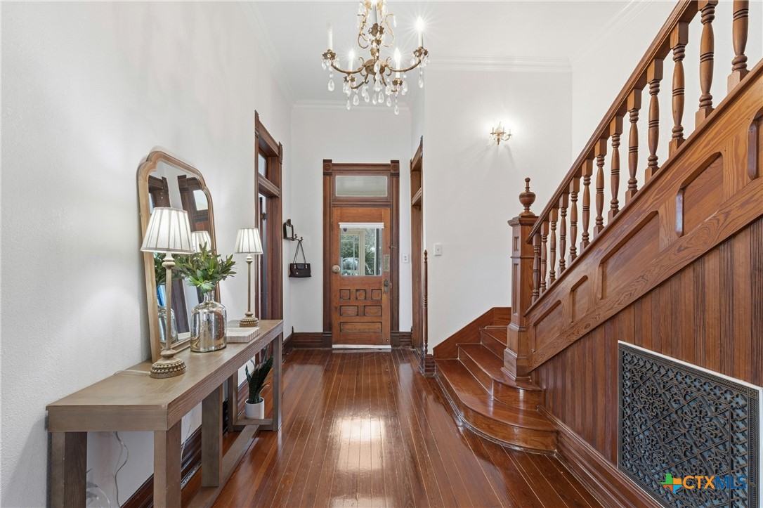 300 Estelle Rice Street Moody, TX 76557 - Photo 5 of 48 a view of an entryway wooden floor and chandelier