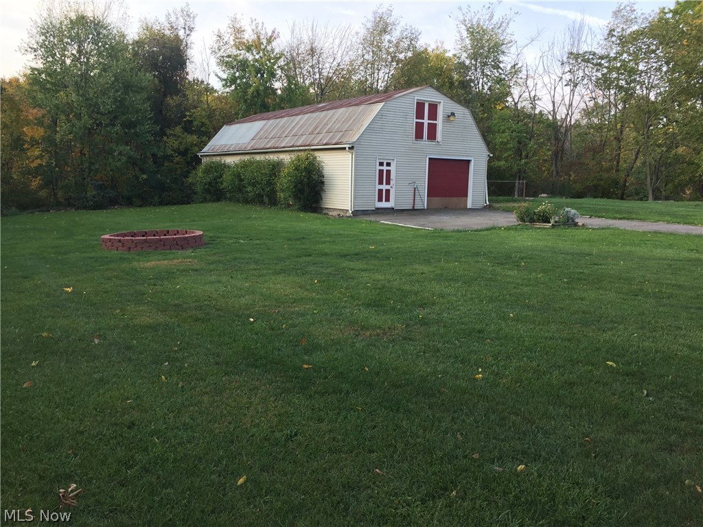 4011 Jaeger Road Lorain, OH 44053 - Photo 5 of 27 two story barn and new fire pit
