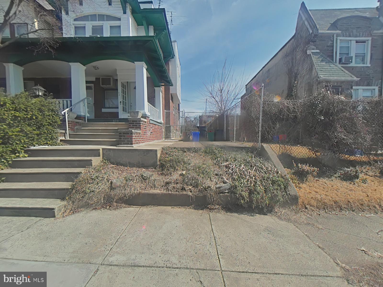 6709 North 15th Street Philadelphia, PA 19126 - Photo 5 of 5 a view of a brick house with many windows