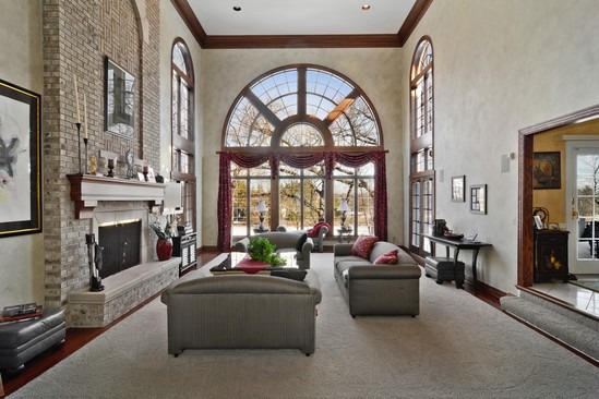 26 Hidden Brook Drive North Barrington, IL 60010 - Photo 7 of 22 a living room with furniture a fireplace and a large window