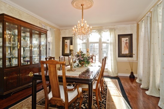 26 Hidden Brook Drive North Barrington, IL 60010 - Photo 8 of 22 a view of a dining room with furniture window and wooden floor