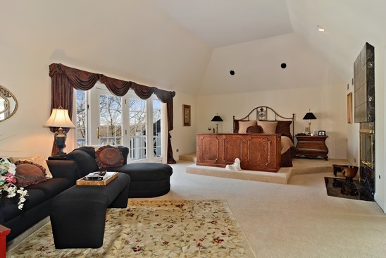 26 Hidden Brook Drive North Barrington, IL 60010 - Photo 10 of 22 a living room with furniture ceiling fan and a large window
