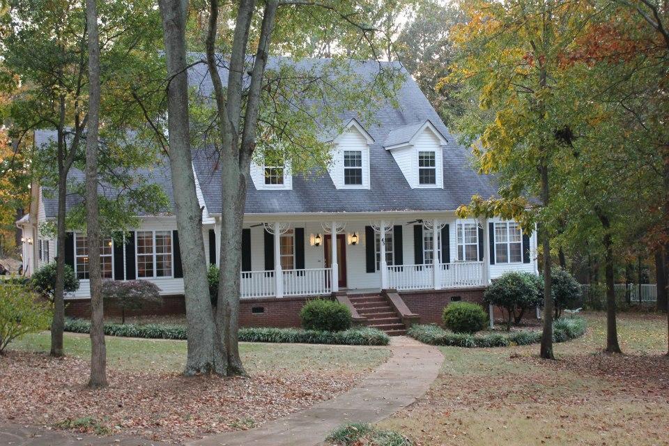 45 Melody Ridge Covington, GA 30014 - Photo 1 of 1 a front view of a house with a yard and trees