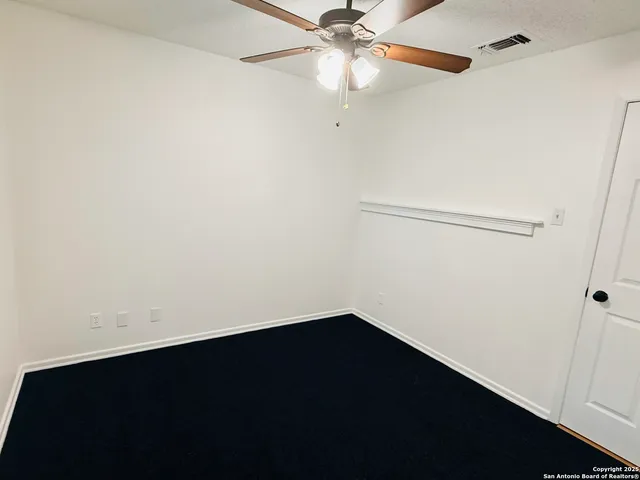 a bathroom with a granite countertop sink and vanity