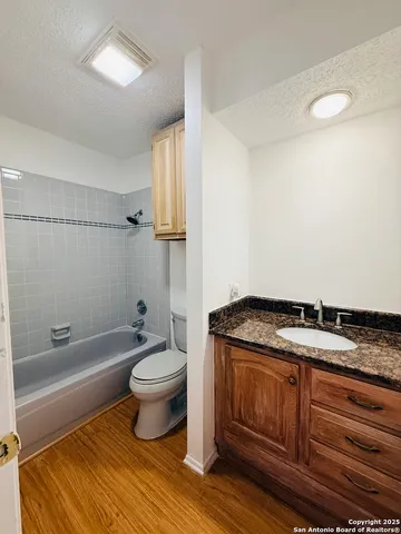 a bathroom with a toilet and a bathtub