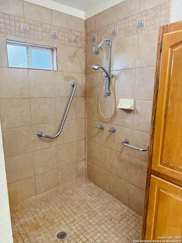 a bathroom with a sink toilet and mirror