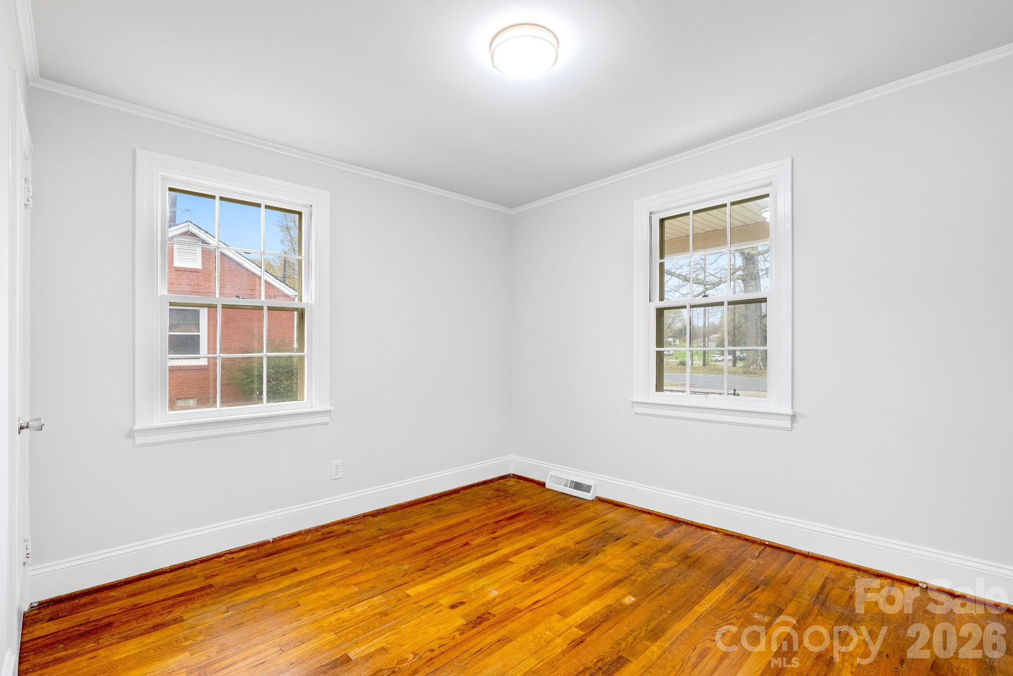 414 Ridge Street Stanley, NC 28164 - Photo 11 of 33 an empty room with a window