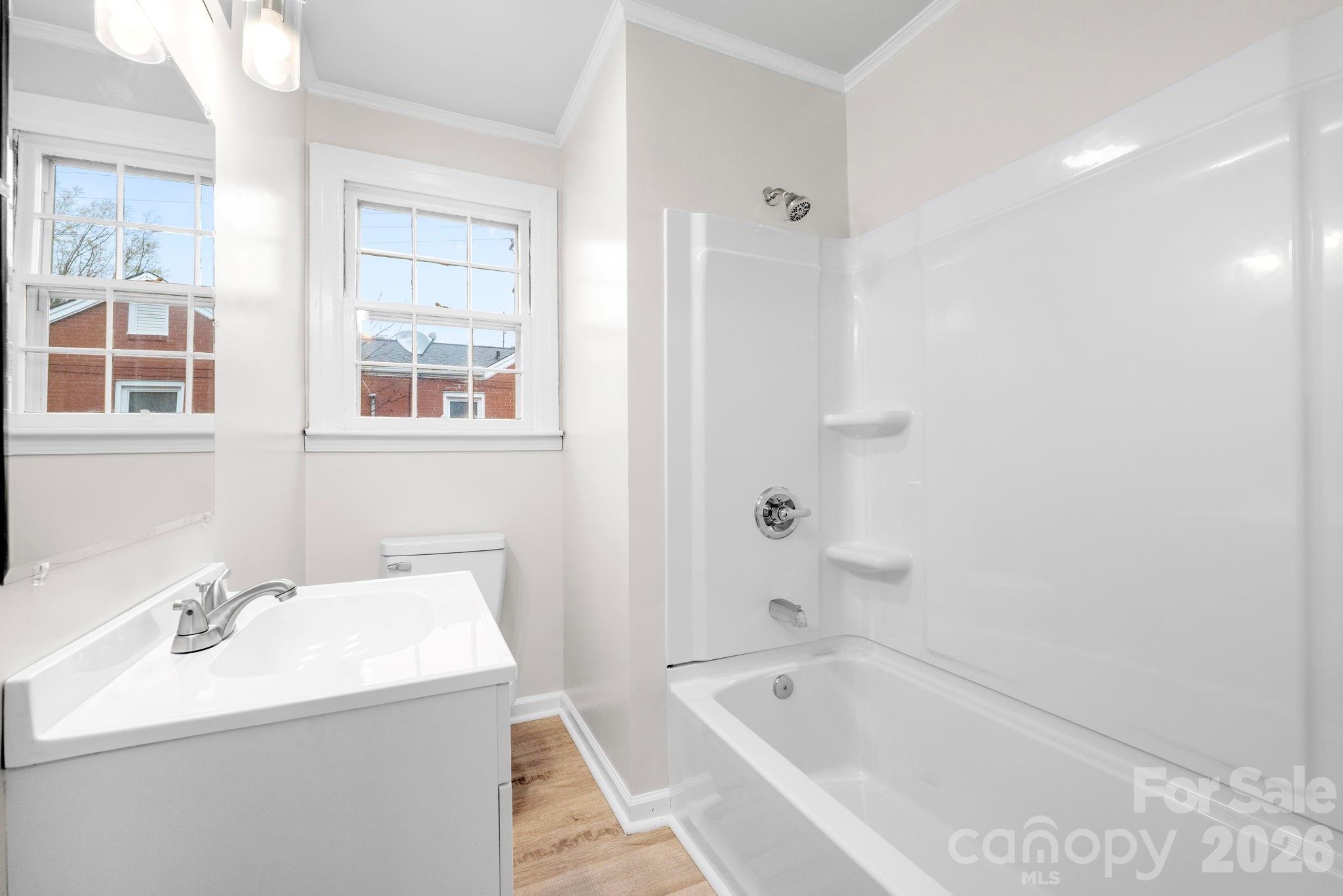 414 Ridge Street Stanley, NC 28164 - Photo 13 of 33 a bathroom with a tub sink and mirror