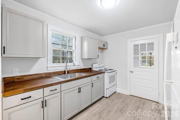 a kitchen with a sink and cabinets
