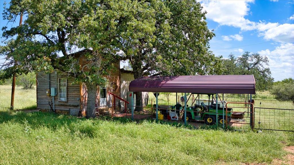 567 Walters Road Mason, TX 76856 - Photo 23 of 26 a view of a yard with a table and a chairs