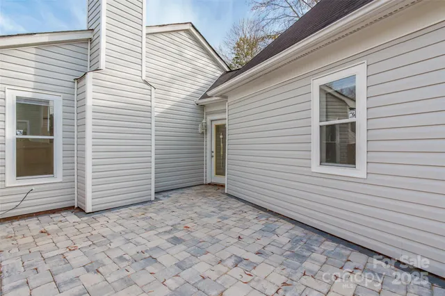 a backyard of a house with lots of green space