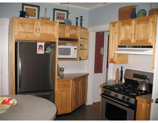 30 Churchill Street Springfield, MA 01108 - Photo 4 of 12 a kitchen with stainless steel appliances granite countertop a stove and a refrigerator