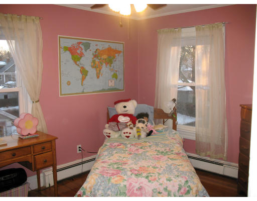 30 Churchill Street Springfield, MA 01108 - Photo 7 of 12 a bed room with a bed and a dresser