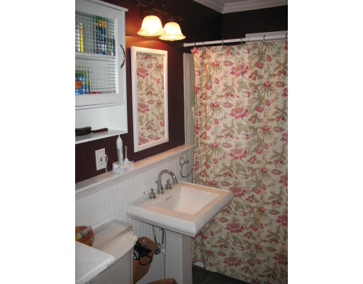 30 Churchill Street Springfield, MA 01108 - Photo 8 of 12 a bathroom with a sink and a mirror