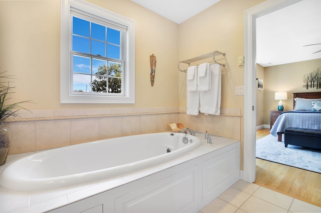33 Old Reed Road Monson, MA 01057 - Photo 20 of 42 a white bath tub sitting next to a bathroom