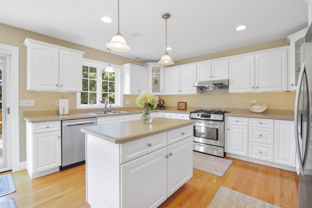33 Old Reed Road Monson, MA 01057 - Photo 10 of 42 a kitchen with white cabinets appliances and a window