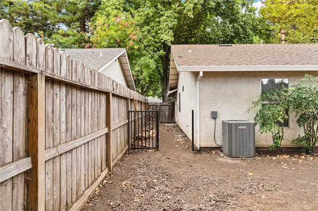 a view of a wooden house with a outdoor space